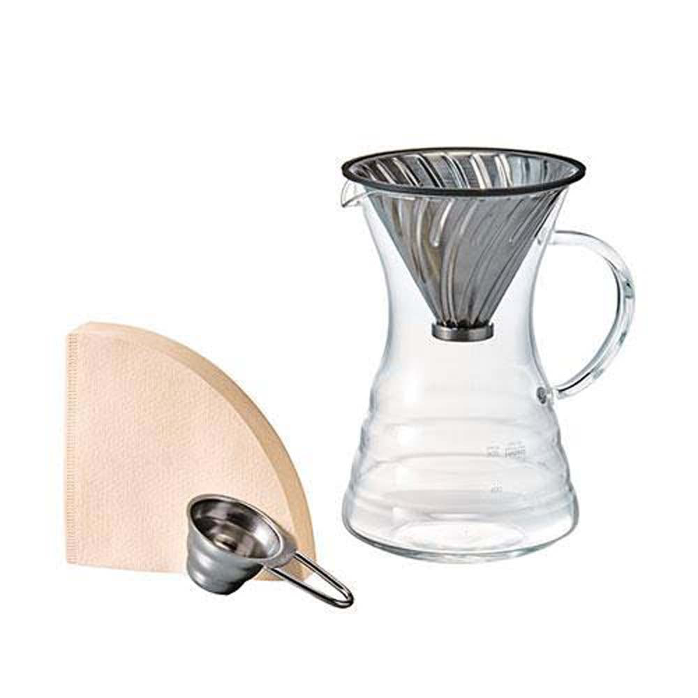 Hario V60 Pour Over Decanter set, includes a glass server, metal dripper, paper filters, and a metal spoon.