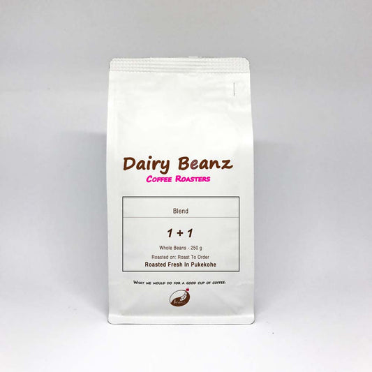 A bag of '1 Plus 1' espresso blend coffee with simple and elegant packaging design.