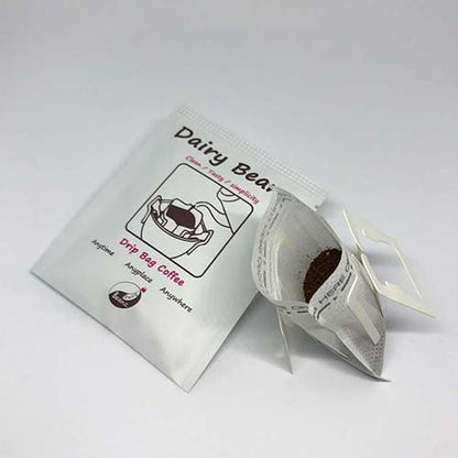 A pack of Beanz Drip alongside an opened drip bag, showing the packaging and coffee inside.