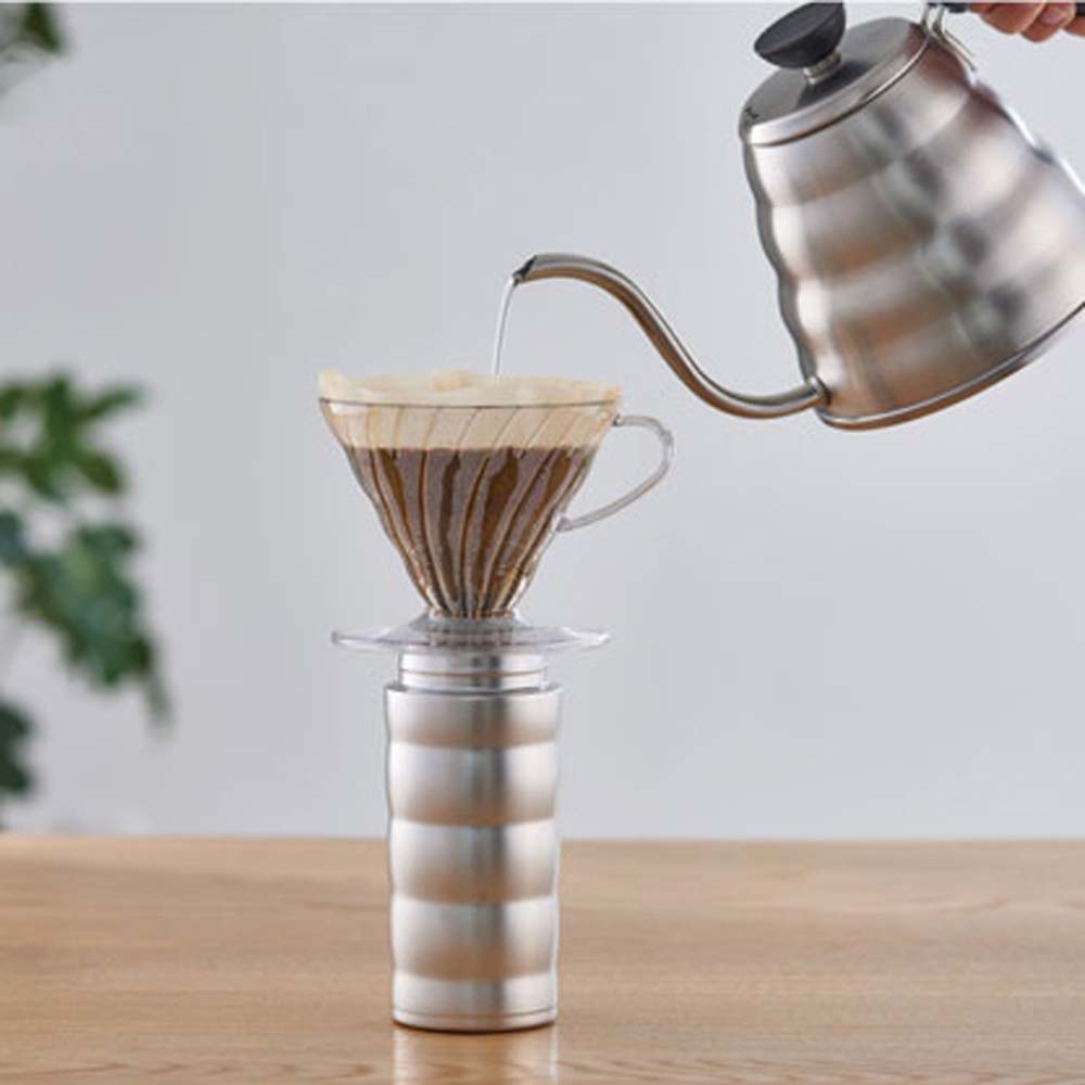Hario V60 Soto Travel Mug fits perfectly under a V60 dripper and pouring hot water, brewing the favorite coffee.